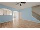 Bright and airy living area with wood floors, open archways, staircase and neutral décor at 2657 Avanti Way, Decatur, GA 30035