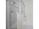 Close up of shower with glass door and chrome shower head inside the bright bathroom at 2657 Avanti Way, Decatur, GA 30035