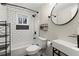 Stylish bathroom featuring white subway tile, a modern sink, and sleek black fixtures, with natural light from a window at 530 Bolton Nw Rd, Atlanta, GA 30331