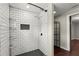 Bathroom shower with a tiled wall and black shelves at 530 Bolton Nw Rd, Atlanta, GA 30331
