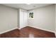 Cozy bedroom featuring hardwood floors, closet and a window bringing in natural light at 530 Bolton Nw Rd, Atlanta, GA 30331