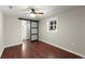 Bedroom featuring hardwood floors, ceiling fan and sliding door leading to the bathroom at 530 Bolton Nw Rd, Atlanta, GA 30331