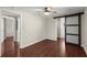 Bedroom featuring hardwood floors, ceiling fan and sliding door leading to the bathroom at 530 Bolton Nw Rd, Atlanta, GA 30331