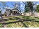 Inviting front yard featuring a lush lawn and a charming, tree-lined setting at 530 Bolton Nw Rd, Atlanta, GA 30331