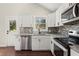 Bright kitchen featuring stainless steel appliances, granite countertops, and white cabinetry at 530 Bolton Nw Rd, Atlanta, GA 30331