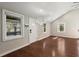 Open living space with high ceilings, light-filled windows, and beautiful dark hardwood floors at 530 Bolton Nw Rd, Atlanta, GA 30331