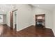 Bright living room highlighting dark wood floors, a sliding barn door, and a cozy fireplace at 530 Bolton Nw Rd, Atlanta, GA 30331