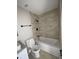 Contemporary bathroom featuring a shower-tub combo with tiled walls and modern fixtures at 1126 Mainstreet Valley Dr, Stone Mountain, GA 30088