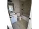 Modern bathroom featuring a vanity with granite countertops, a toilet, and a shower with tile walls at 1126 Mainstreet Valley Dr, Stone Mountain, GA 30088