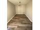 Dining room with wood floors and modern lighting at 1126 Mainstreet Valley Dr, Stone Mountain, GA 30088