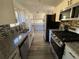 Modern kitchen featuring stainless steel appliances and updated countertops at 1126 Mainstreet Valley Dr, Stone Mountain, GA 30088