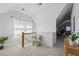 Upstairs hallway featuring neutral walls, cozy chair, and lots of natural light at 185 Elvan Ne Ave, Atlanta, GA 30317