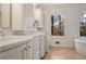 Bathroom with double vanity, bathtub, and large window at 3964 Preston Ne Ct, Brookhaven, GA 30319