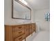Bathroom with large vanity mirror and wood cabinet at 3964 Preston Ne Ct, Brookhaven, GA 30319