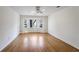 Hardwood floor bedroom with bay window and ceiling fan at 3964 Preston Ne Ct, Brookhaven, GA 30319