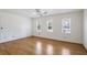 Spacious bedroom with hardwood floors and multiple windows at 3964 Preston Ne Ct, Brookhaven, GA 30319