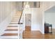 Two-story entryway with hardwood floors and a chandelier at 3964 Preston Ne Ct, Brookhaven, GA 30319
