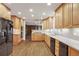 Kitchen with light wood cabinets, granite countertops, and stainless steel appliances at 3964 Preston Ne Ct, Brookhaven, GA 30319