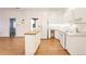 Kitchen with white cabinets, hardwood floors and island at 3964 Preston Ne Ct, Brookhaven, GA 30319