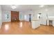 Open kitchen with island and white cabinets, hardwood floors at 3964 Preston Ne Ct, Brookhaven, GA 30319
