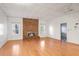 Living room with brick fireplace and hardwood floors at 3964 Preston Ne Ct, Brookhaven, GA 30319