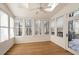 Bright sunroom featuring hardwood floors and multiple windows at 3964 Preston Ne Ct, Brookhaven, GA 30319