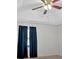 Bedroom with ceiling fan and dark blue curtains at 761 Woodwind Dr, Rockmart, GA 30153
