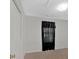 Small bedroom with closet and black curtains at 761 Woodwind Dr, Rockmart, GA 30153