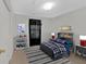 Cozy bedroom with twin bed and decorative accents at 761 Woodwind Dr, Rockmart, GA 30153