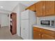 Kitchen features white appliances and ample cabinet space at 761 Woodwind Dr, Rockmart, GA 30153