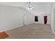 Spacious living room with vaulted ceiling and neutral carpet at 761 Woodwind Dr, Rockmart, GA 30153