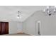 Open living room with neutral color palette and high ceilings at 761 Woodwind Dr, Rockmart, GA 30153