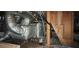 Utility equipment and pipes in unfinished basement with wood panels at 126 Meadow Park Sw Ln, Atlanta, GA 30315