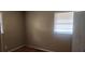 Bedroom featuring a bright window and hardwood floors at 126 Meadow Park Sw Ln, Atlanta, GA 30315