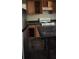 This kitchen offers appliances, a table, and wooden cabinets at 126 Meadow Park Sw Ln, Atlanta, GA 30315