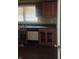 This kitchen offers a sink, dishwasher, and wooden cabinets at 126 Meadow Park Sw Ln, Atlanta, GA 30315