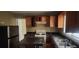 This kitchen offers appliances and wooden cabinets for storage at 126 Meadow Park Sw Ln, Atlanta, GA 30315