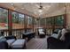 Relaxing screened porch with wicker furniture and string lights at 2181 Ivey Creek Way, Stone Mountain, GA 30087