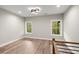 Open loft area with two windows and wood flooring at 2329 Mason Dr # D24, Atlanta, GA 30316