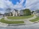 A pleasant street view with well-manicured lawns and homes at 300 Downing Creek Trl, Canton, GA 30114