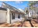 Home's exterior with deck and wooded backyard at 849 Hillandale Ln, Lithonia, GA 30058