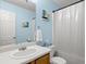 Clean bathroom with light blue walls, bathtub, and shower at 849 Hillandale Ln, Lithonia, GA 30058