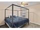 Spacious bedroom with a large canopy bed and ceiling fan at 849 Hillandale Ln, Lithonia, GA 30058