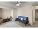 Multi-purpose bonus room featuring a sleeper sofa and access to upper level at 849 Hillandale Ln, Lithonia, GA 30058