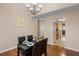 Dining area with four chairs and kitchen view at 849 Hillandale Ln, Lithonia, GA 30058
