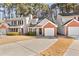 Front view of a townhome with a brick facade and landscaping at 849 Hillandale Ln, Lithonia, GA 30058