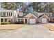 Townhouse exterior featuring a brick facade and driveway at 849 Hillandale Ln, Lithonia, GA 30058