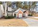 Brick front townhouse with attached garage and landscaping at 849 Hillandale Ln, Lithonia, GA 30058