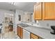 Kitchen with light wood cabinets, granite countertops, and appliances at 849 Hillandale Ln, Lithonia, GA 30058