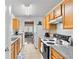 Eat-in kitchen with wood cabinets and granite countertops at 849 Hillandale Ln, Lithonia, GA 30058